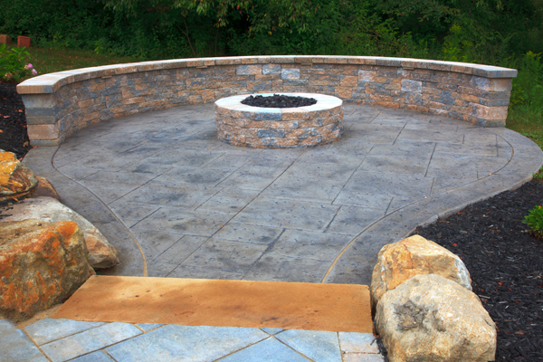 Techo-Bloc Firepit with Matching Seatwall on Concrete Patio